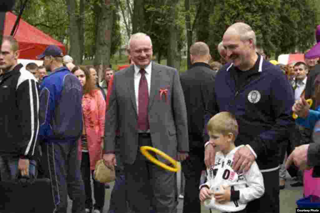 Lukashenka with Kolya, who's holding an iPhone, in Gorky Park in Minsk in May 2010. 